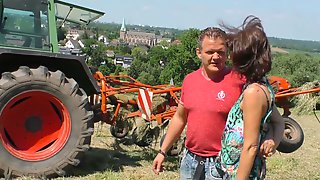 Bent over the tractor mature village..